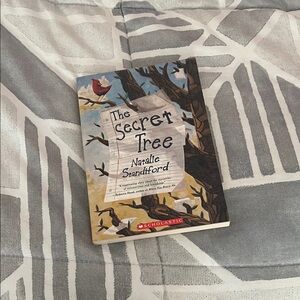 Scholastic Illustrated Copy of The Secret Tree — Blue, Brown, Cover